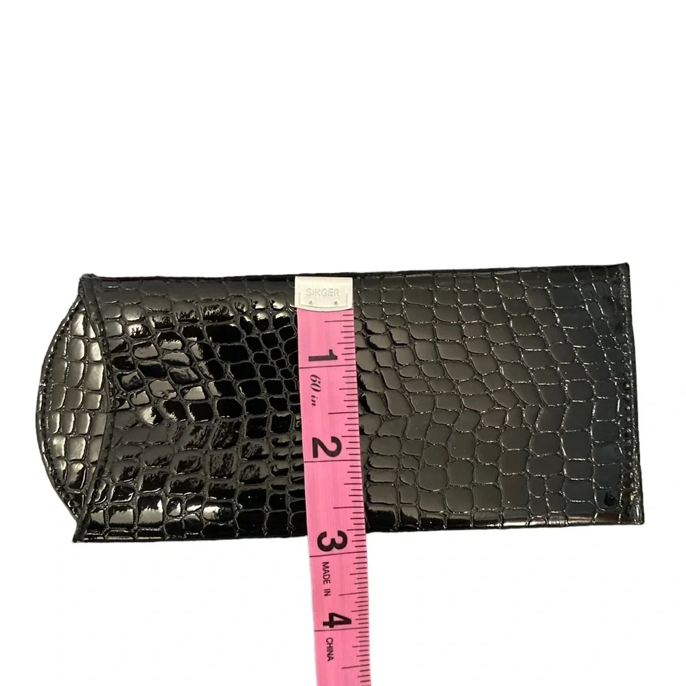 Double-sided black leather eyeglasses case. Holds 2 pairs of glasses. Used